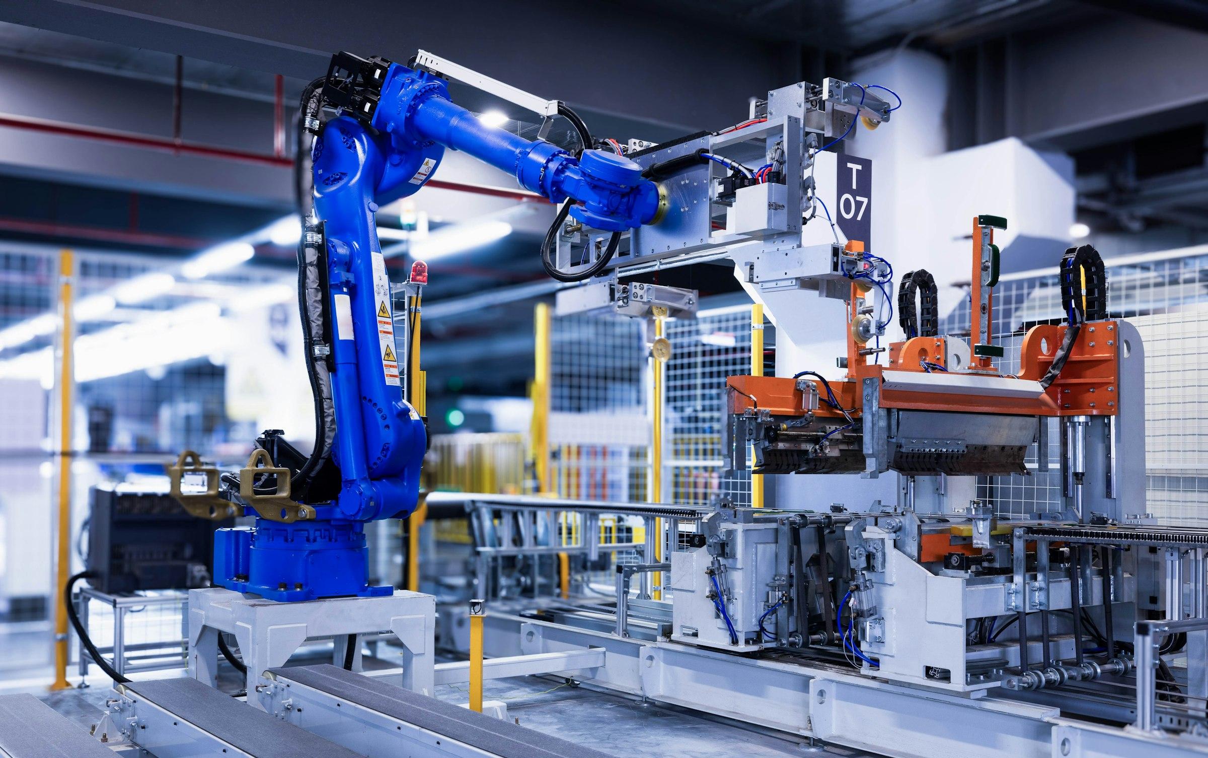 Industrial robotic arm on an automated production line.