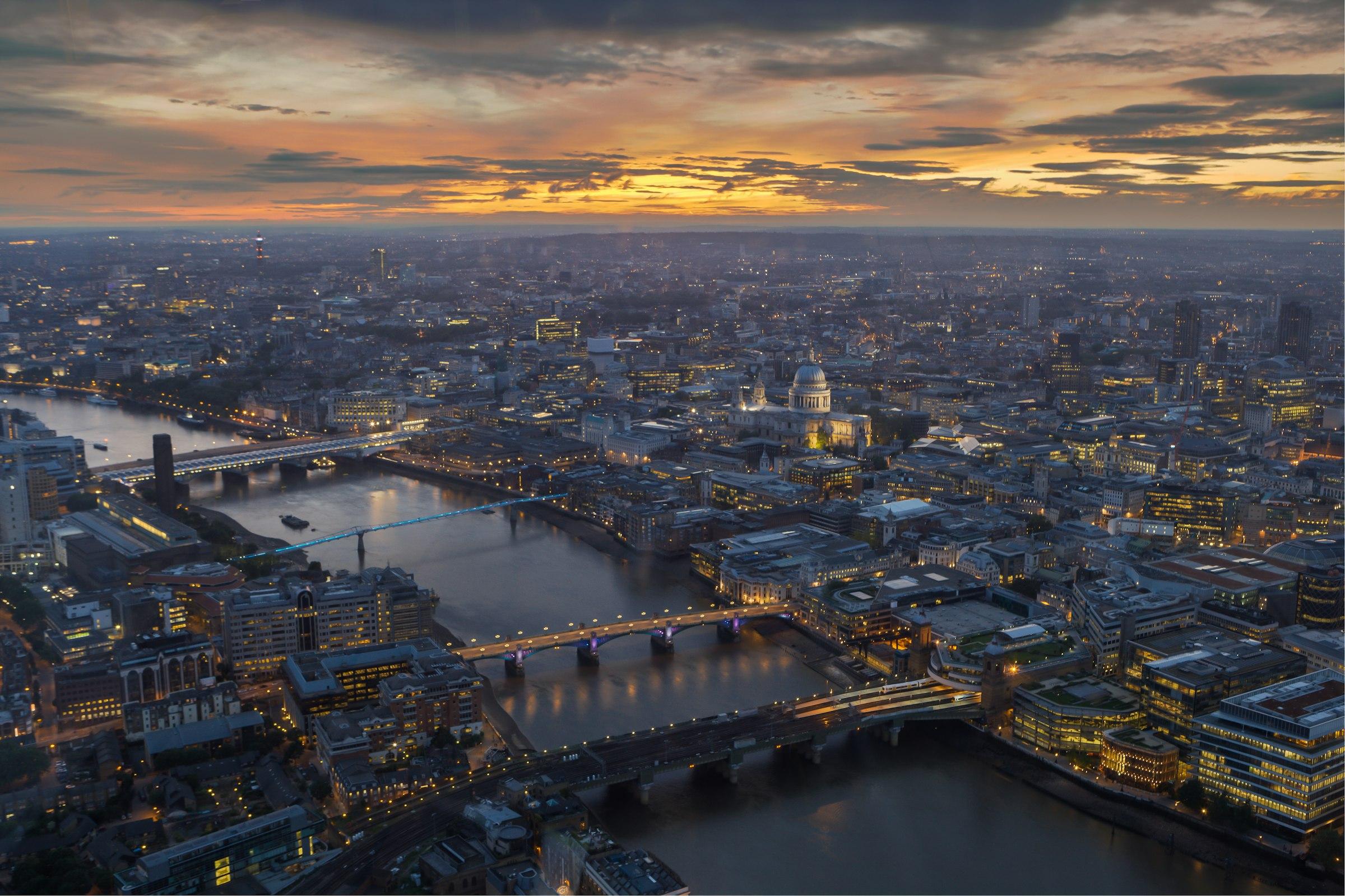 Aerial view of the River Thames and St Paul's Cathedral at dusk.